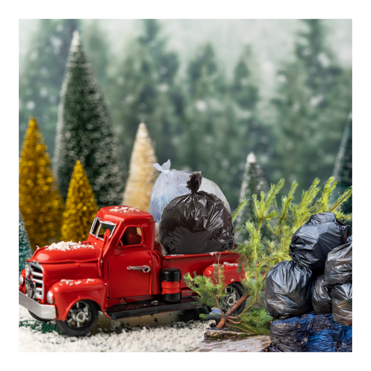 A red toy truck in an idyllic Christmas postcard forest scene, filled with and surrounded by old Christmas decorations headed for the landfill.